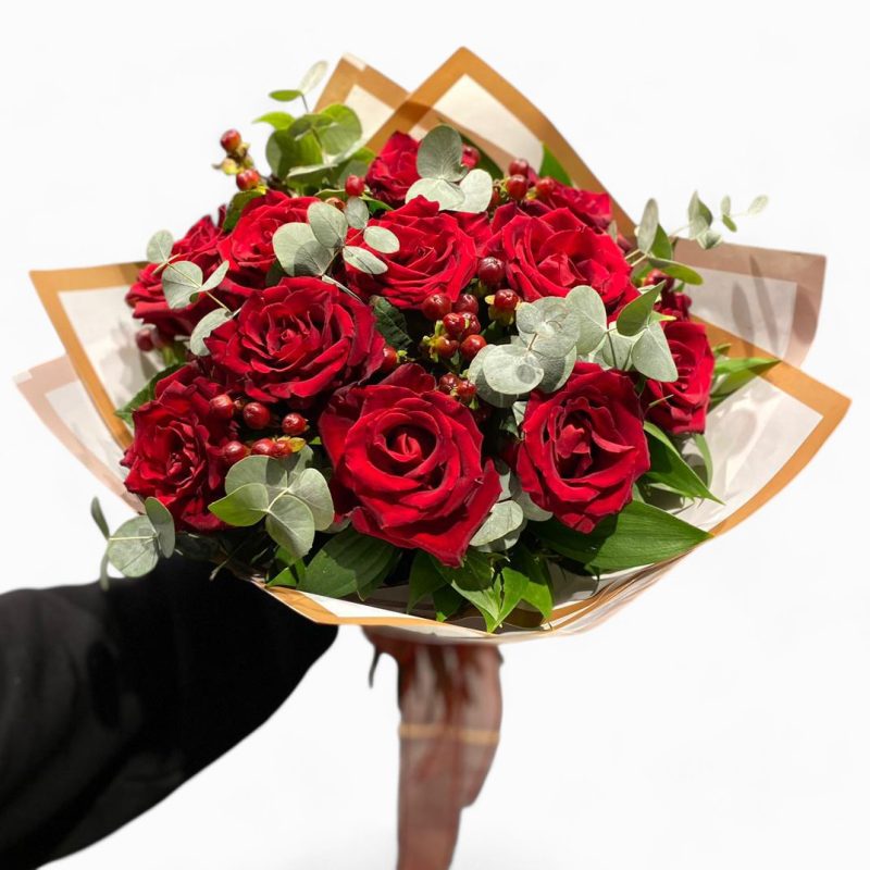 Crimson Delight Red Rose Bouquet The Crimson Delight Red Rose Bouquet is an elegant arrangement of premium red roses accented with fresh eucalyptus and hypericum berries, wrapped in a chic two-tone wrap that adds a luxurious touch. This timeless bouquet is perfect for romantic gestures, anniversaries, or any occasion where you want to make a lasting impression. With its vibrant red roses symbolizing deep love and admiration, this bouquet is a classic choice for expressing heartfelt emotions. 7-Day Fresh Guarantee: Enjoy the freshness and beauty of the roses for up to a week with proper care. Perfect for: Anniversaries, romantic surprises, special celebrations, or just because. Flower Care Instructions: Keep in fresh water, trim the stems regularly, and avoid direct sunlight for longer-lasting beauty.