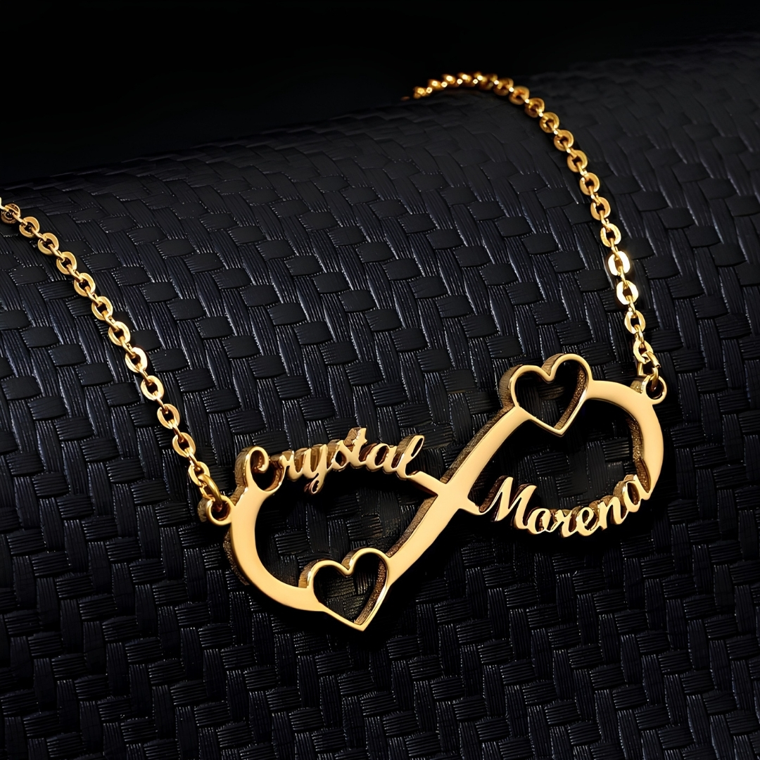 Celebrate love, connection, and togetherness with this beautiful custom infinity couple name necklace, designed with two personalized names, elegant heart details, and a shiny gold-color finish. The infinity design represents a bond that lasts forever, making it a perfect gift for couples, best friends, sisters, mothers, or loved ones. This necklace can be customized with your chosen names, creating a meaningful piece of jewelry that feels personal and special. Its stylish design makes it perfect for everyday wear, anniversaries, birthdays, engagements, Valentine’s Day, Eid gifts, or surprise romantic gifts. A lovely personalized necklace for anyone who wants to keep two special names close to the heart. Product Features: Customizable with two names Infinity symbol design Double heart details Elegant gold-color finish Lightweight and comfortable for daily wear Perfect gift for couples, sisters, best friends, and loved ones Suitable for birthdays, anniversaries, Valentine’s Day, Eid, and special occasions Available for delivery in Kuwait